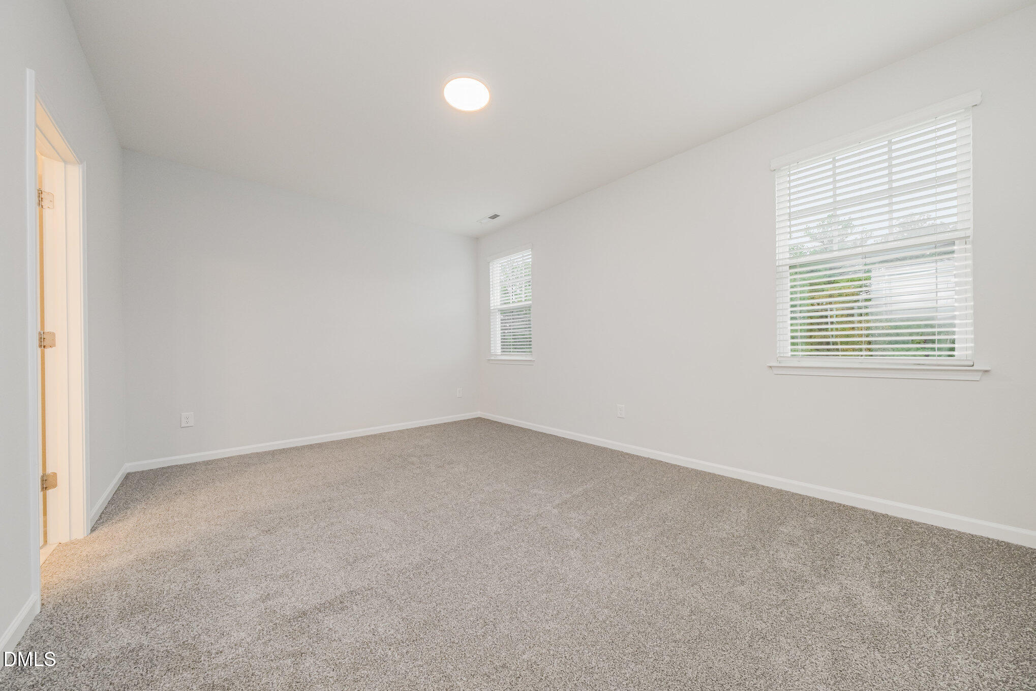 1019 Islip Place Durham, NC 27703 - Photo 8 of 18 an empty room with windows