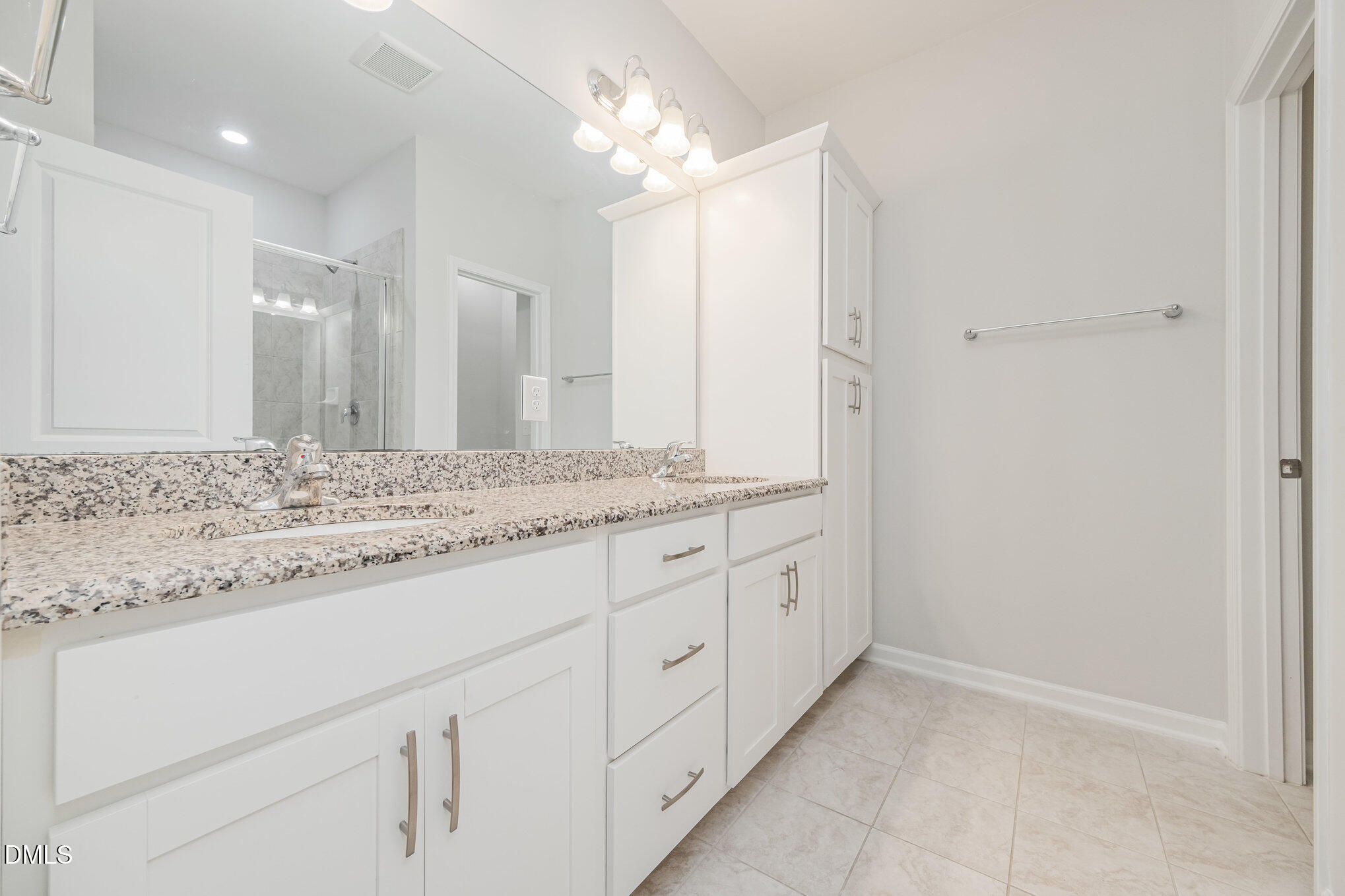 1019 Islip Place Durham, NC 27703 - Photo 9 of 18 a bathroom with a granite countertop sink and a mirror