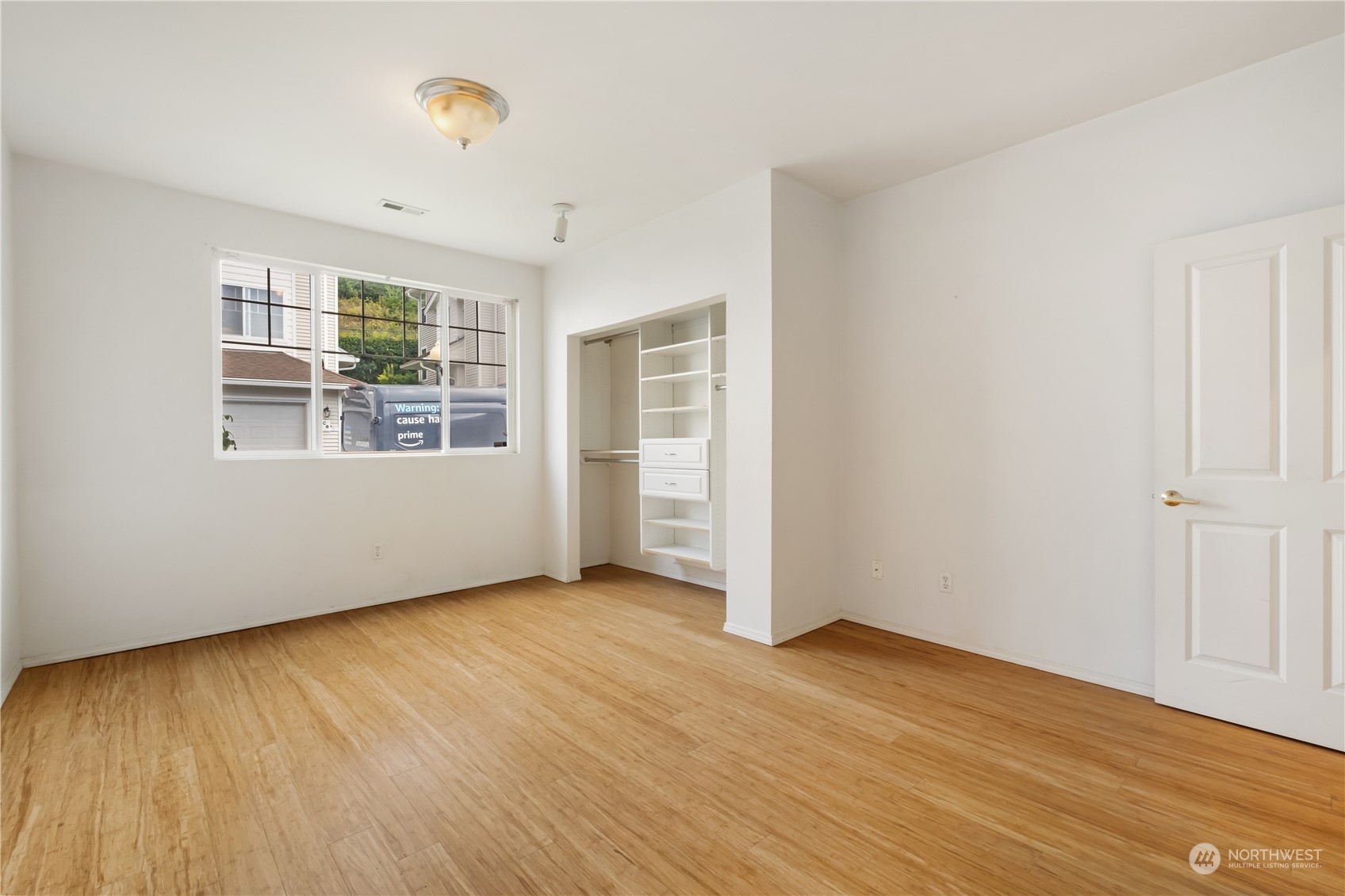2300 Benson Road South, Unit H1 Renton, WA 98055 - Photo 14 of 27 an empty room with wooden floor and windows