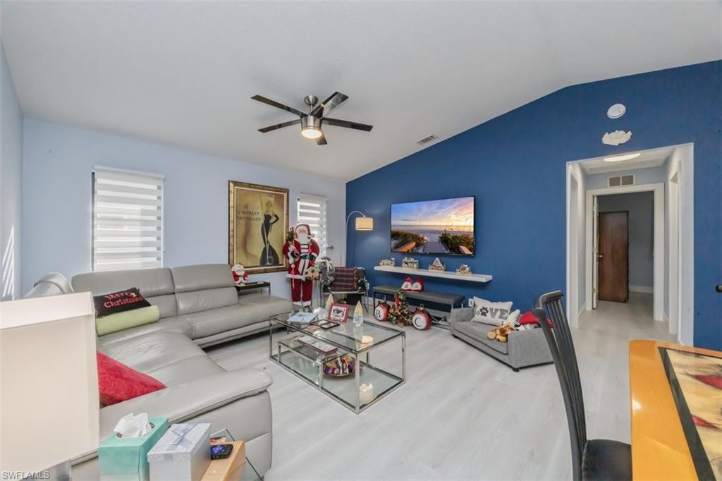 4228 31st Place Southwest Naples, FL 34116 - Photo 11 of 28 a living room with furniture and a window