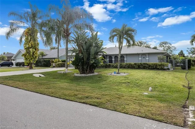 a view of a swimming pool with a garden