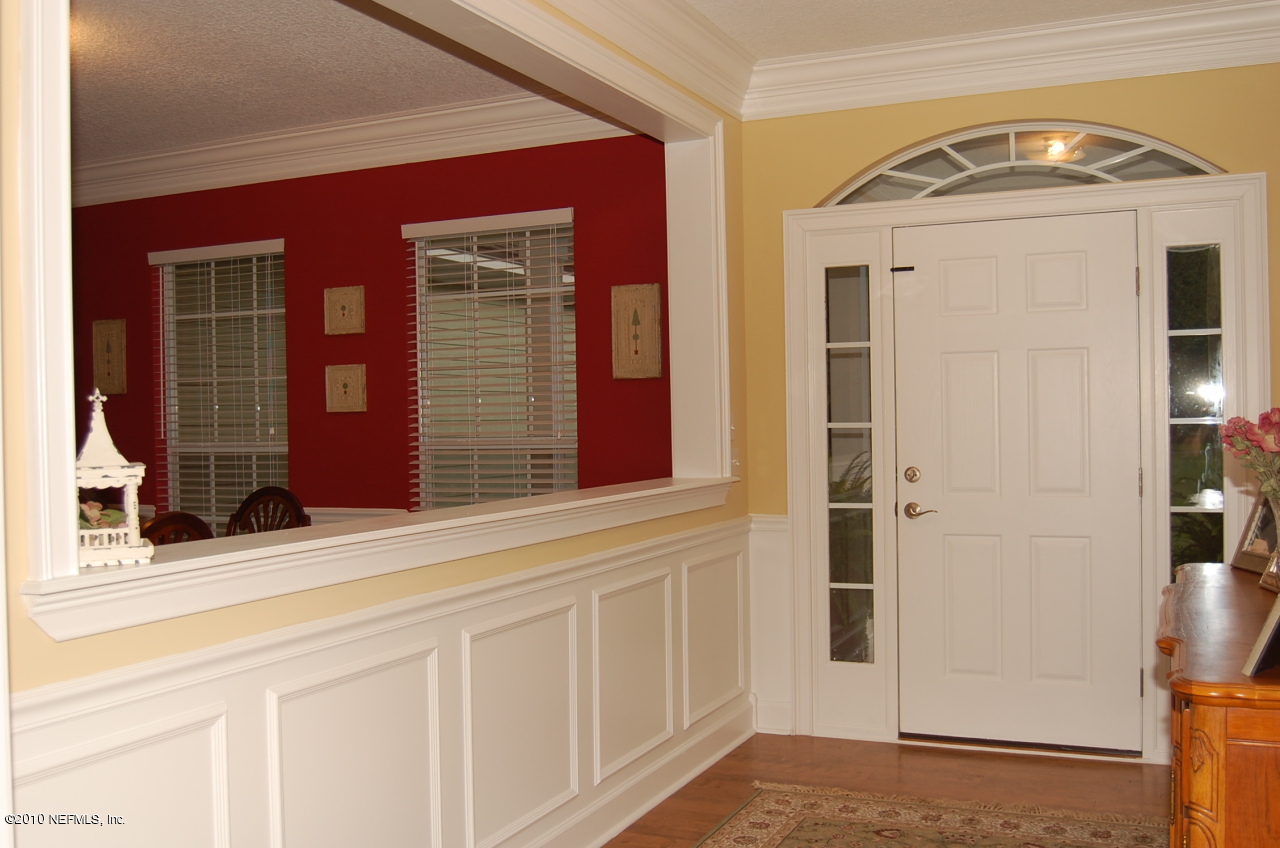 17367 Brandy Branch Road Jacksonville, FL 32234 - Photo 3 of 15 Foyer- Wainscoting & Crown Molding