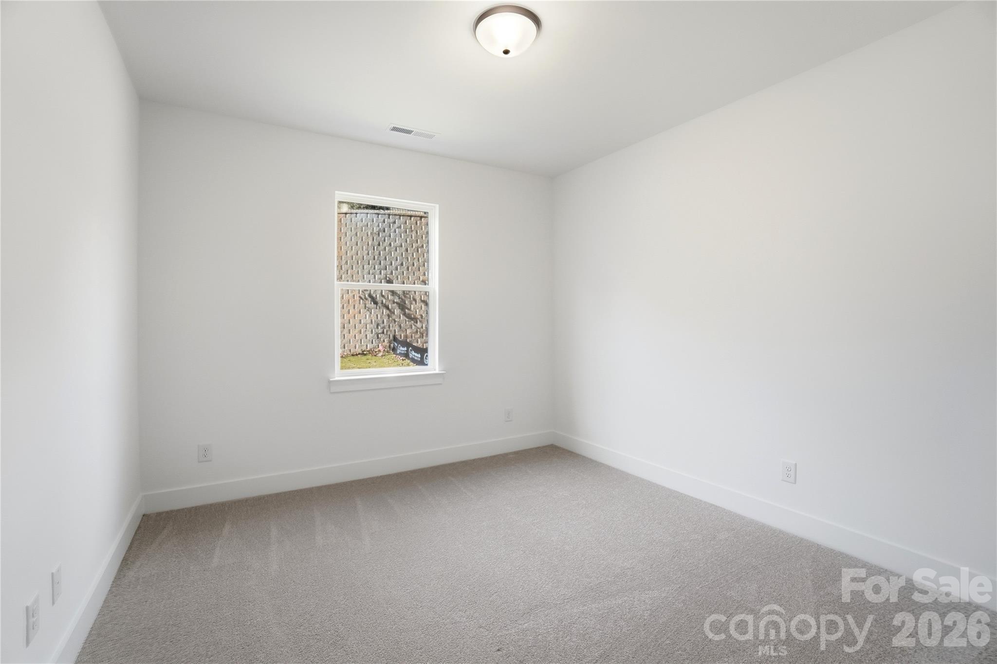 107 Longwood Road Mooresville, NC 28115 - Photo 17 of 43 a view of an empty room with a window
