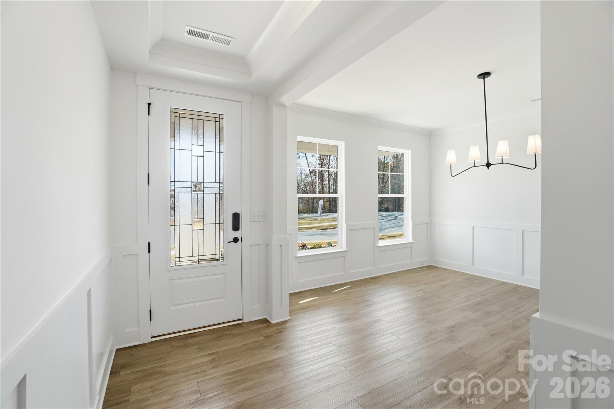 107 Longwood Road Mooresville, NC 28115 - Photo 5 of 43 a view of an empty room with window and wooden floor