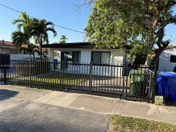 a view of a house with a iron gate