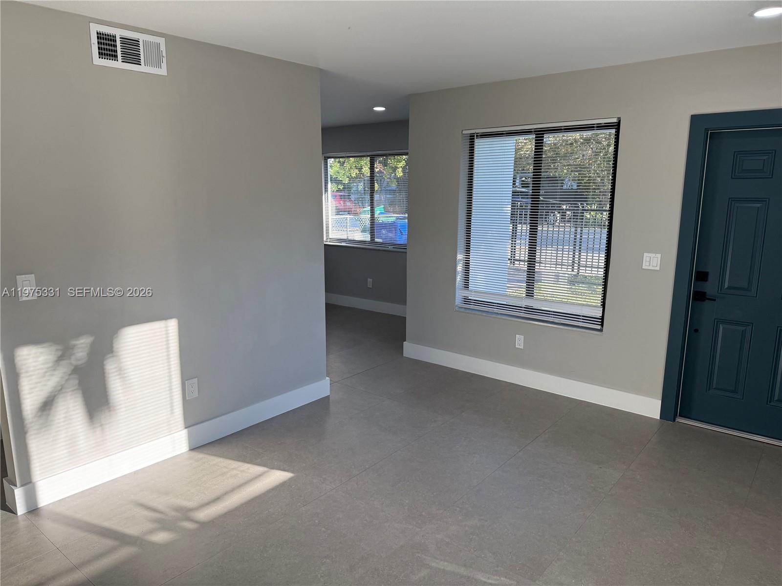 3275 Southwest 27th Street, Unit 3275 Miami, FL 33133 - Photo 9 of 17 an empty room with windows and closet