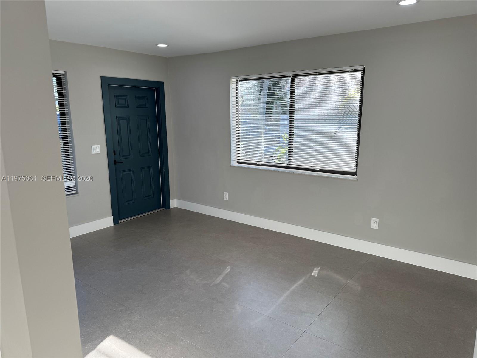 3275 Southwest 27th Street, Unit 3275 Miami, FL 33133 - Photo 10 of 17 an empty room with windows and closet