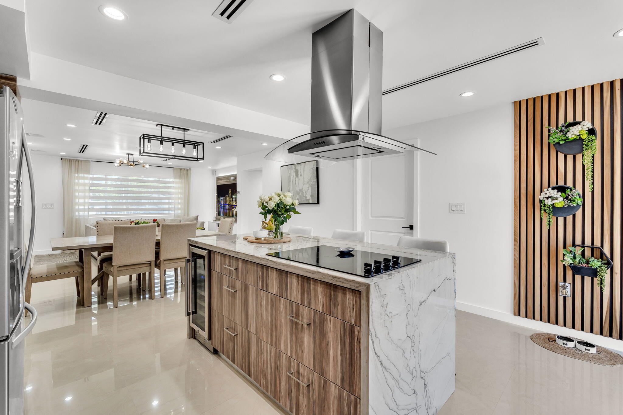 11290 Southwest 48th Street Miami, FL 33165 - Photo 15 of 53 a kitchen with stainless steel appliances kitchen island a stove a sink a dining table and chairs