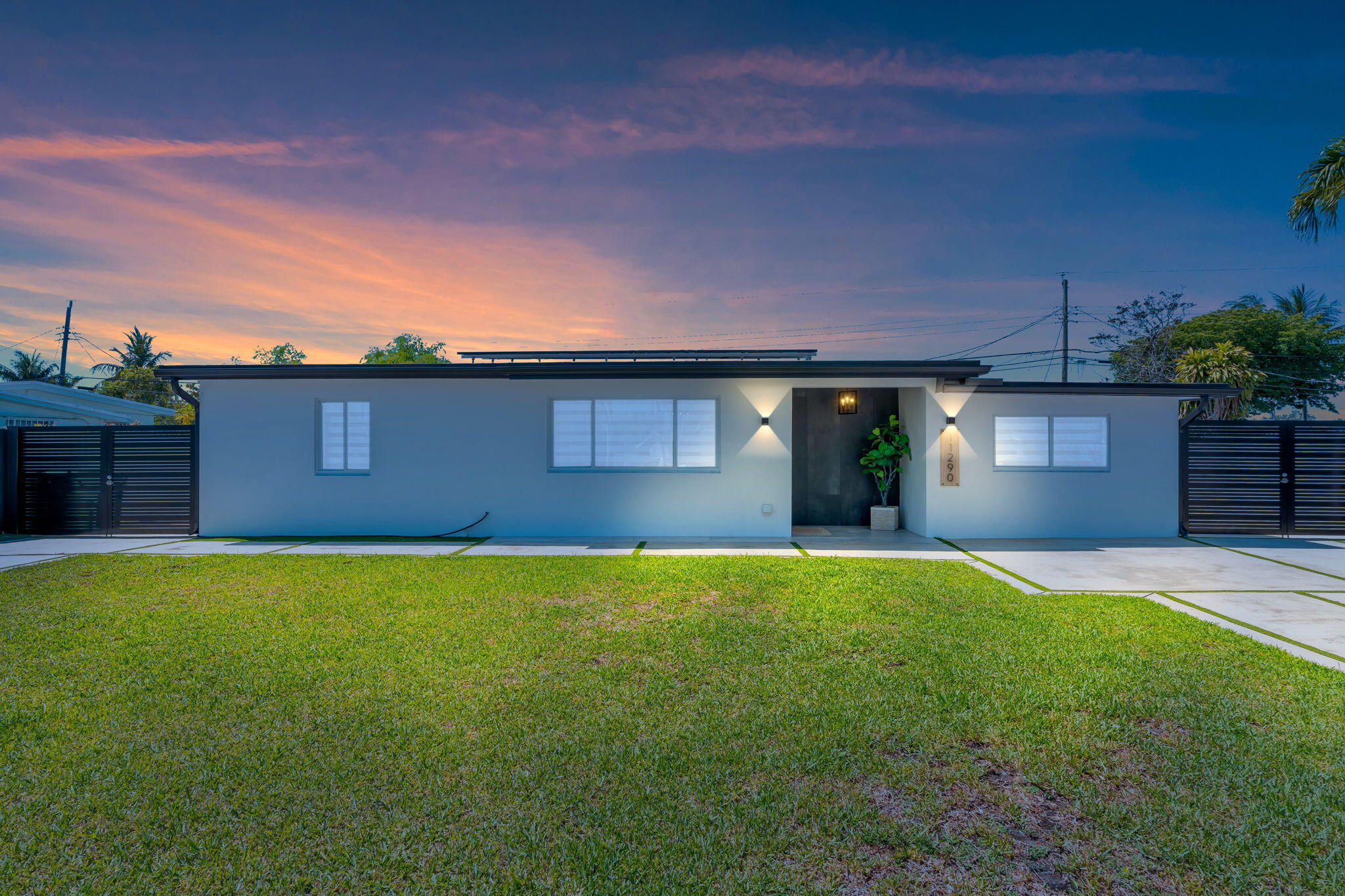 11290 Southwest 48th Street Miami, FL 33165 - Photo 2 of 53 a view of a house with a yard and garage
