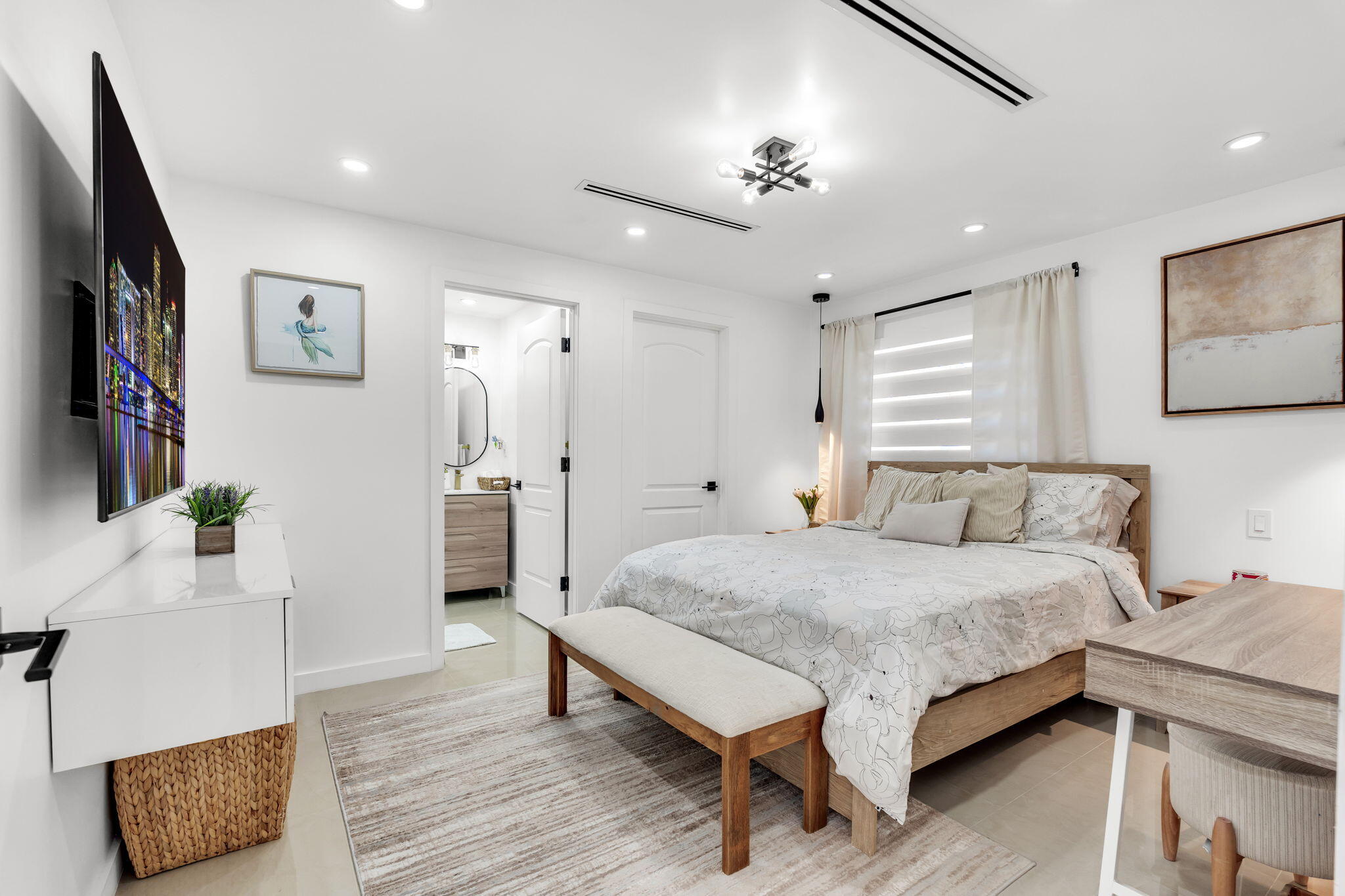 11290 Southwest 48th Street Miami, FL 33165 - Photo 27 of 53 a spacious bedroom with a bed and a flat screen tv