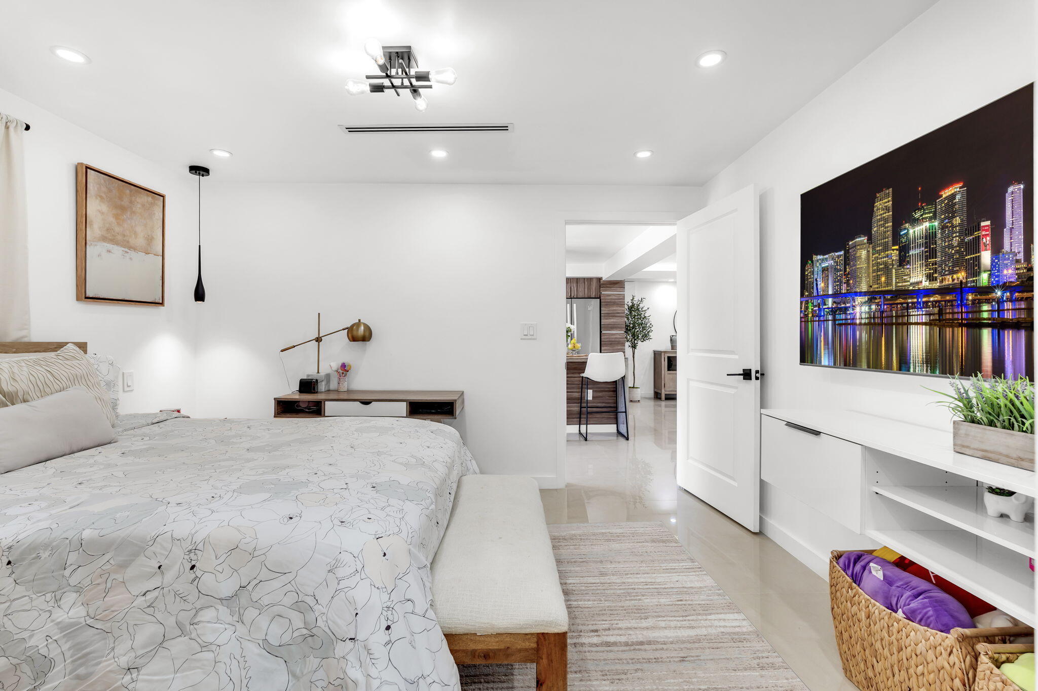 11290 Southwest 48th Street Miami, FL 33165 - Photo 28 of 53 a large bedroom with a bed and wooden floor