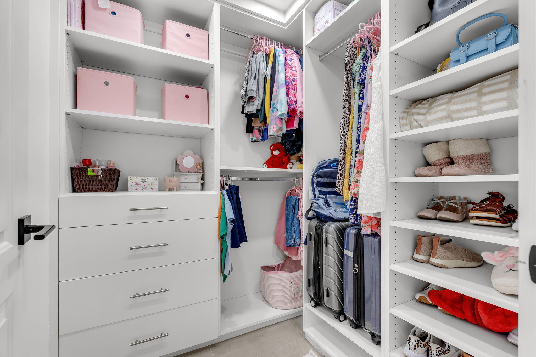 11290 Southwest 48th Street Miami, FL 33165 - Photo 31 of 53 a view of walk in closet with clothes and shoes