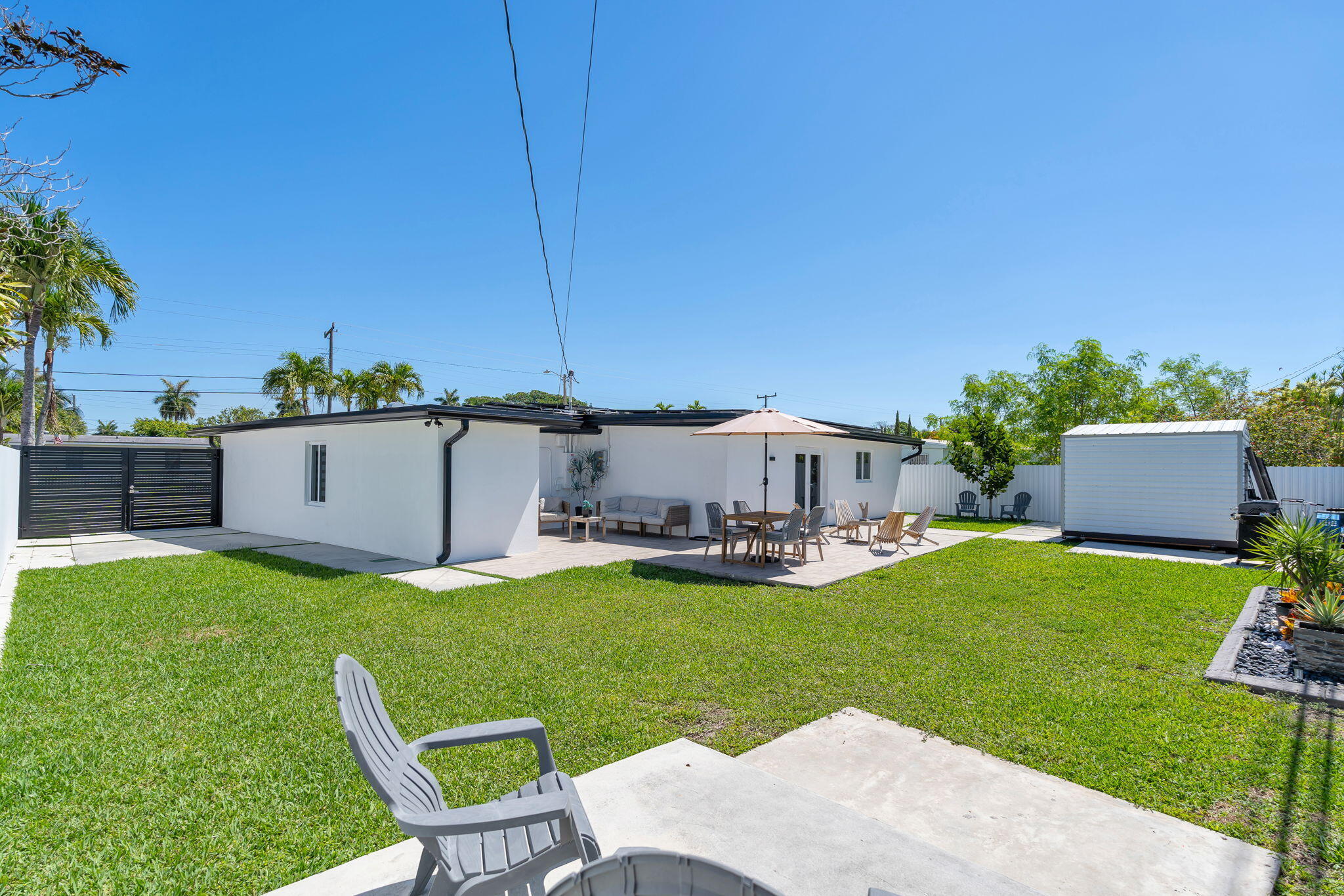 11290 Southwest 48th Street Miami, FL 33165 - Photo 39 of 53 a view of a house with a yard and sitting area