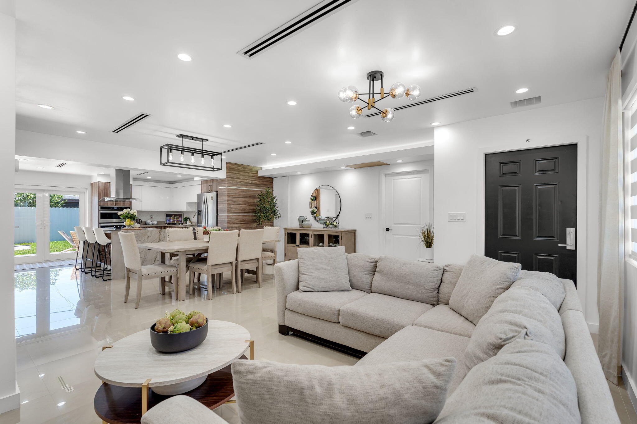 11290 Southwest 48th Street Miami, FL 33165 - Photo 9 of 53 a living room with lots of furniture and view of kitchen
