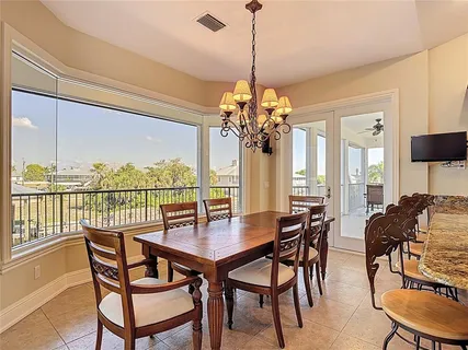 a bathroom with a granite countertop bathtub and shower