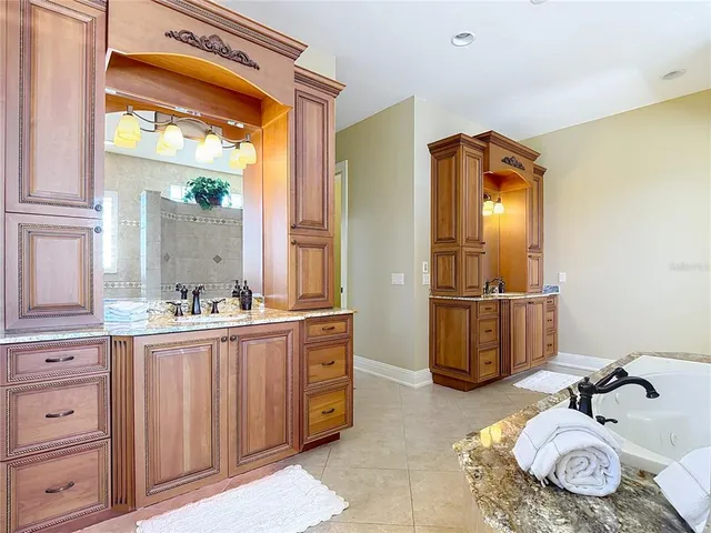 a view of a house with backyard patio and swimming pool