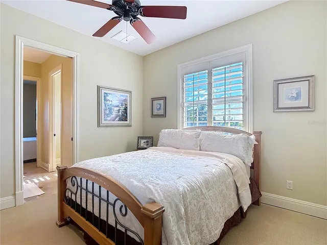 a view of a lake with a table and chairs