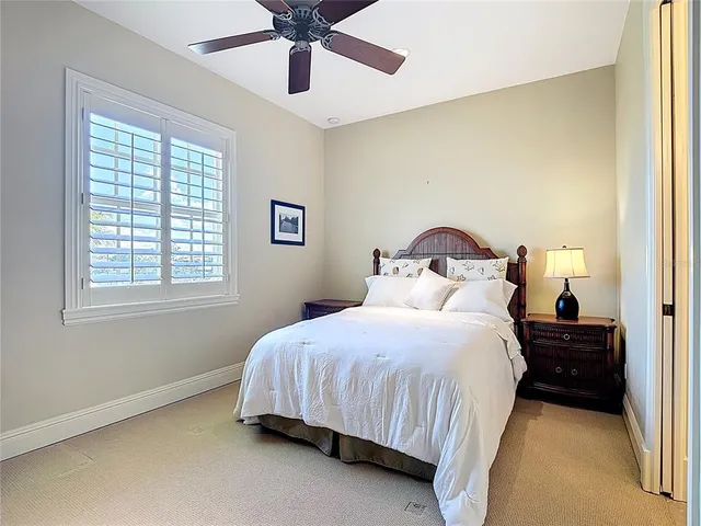 a view of a house with pool and chairs
