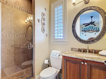 a living room with furniture couch and a potted plant