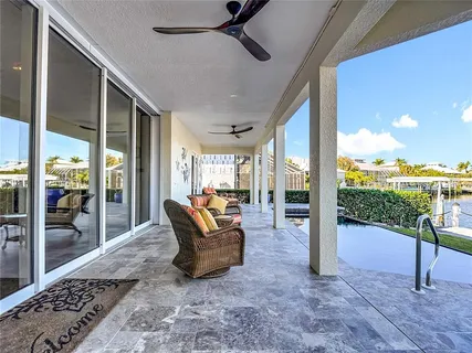 a view of a livingroom with furniture and a flat screen tv