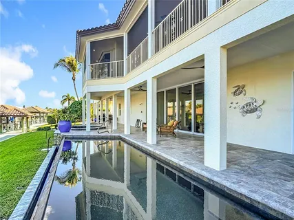 a living room with furniture couch and a potted plant