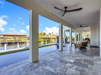 a kitchen with stainless steel appliances granite countertop a sink dishwasher and cabinets with wooden floor
