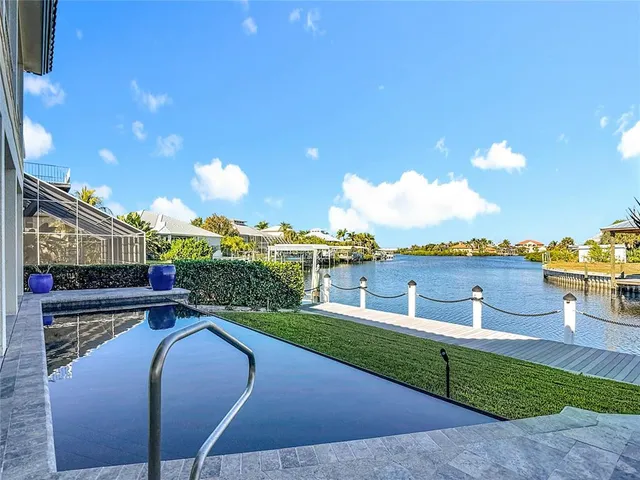 a view of a livingroom with furniture and a flat screen tv