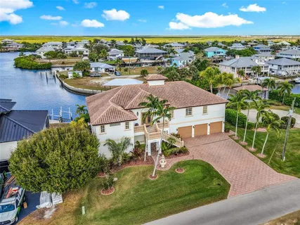 an aerial view of a house with swimming pool