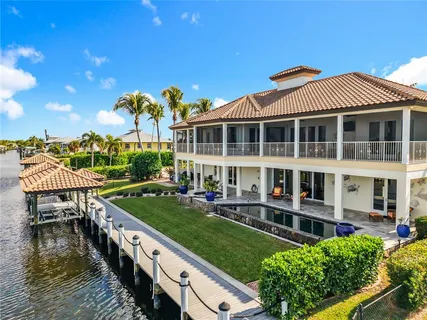 an aerial view of a house with a lake view