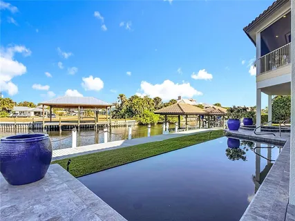 a view of swimming pool with outdoor seating
