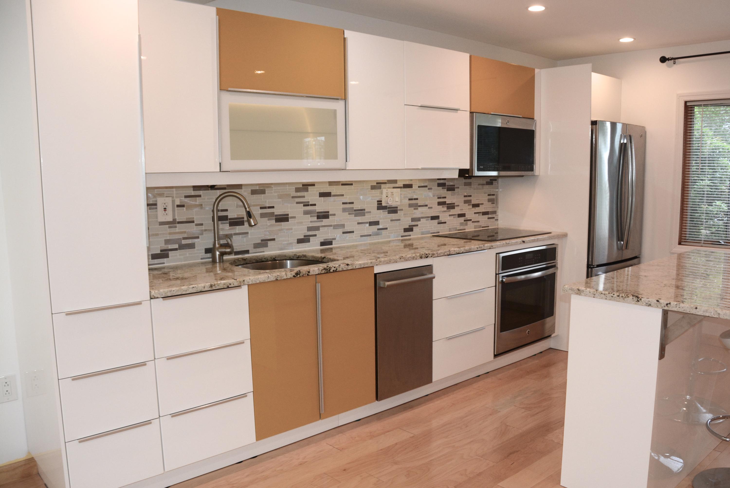 165 Hollow Tree Ridge Road Darien, CT 06820 - Photo 3 of 37 a kitchen with stainless steel appliances granite countertop a stove a sink and a refrigerator