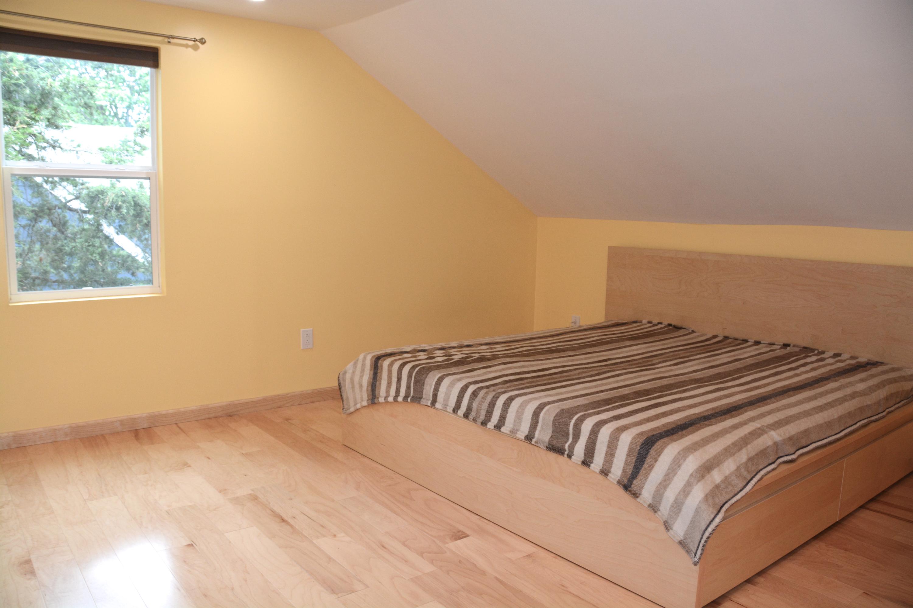 165 Hollow Tree Ridge Road Darien, CT 06820 - Photo 32 of 37 a bedroom with a bed and a window