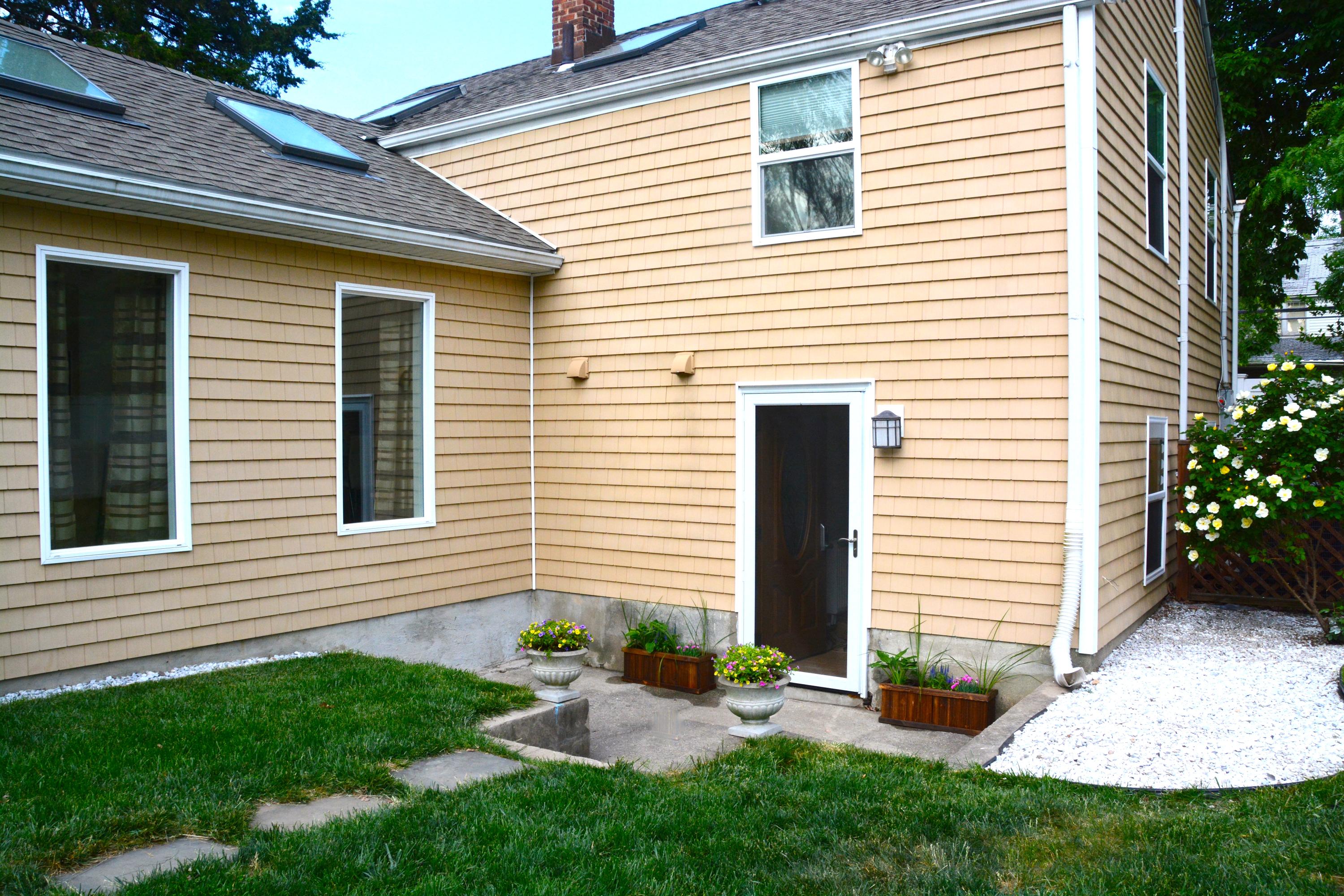 165 Hollow Tree Ridge Road Darien, CT 06820 - Photo 34 of 37 a view of a house with a yard and sitting area