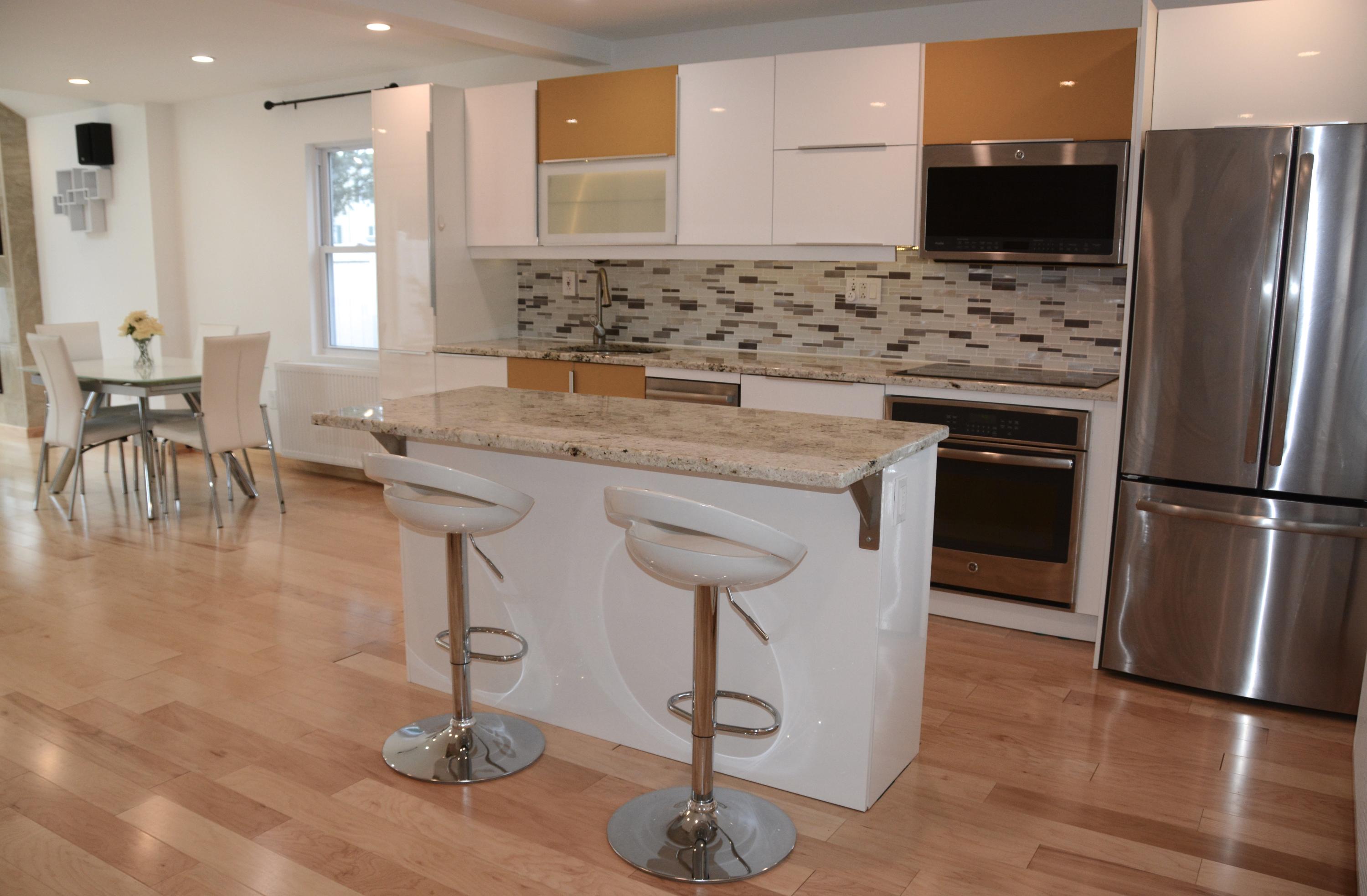 165 Hollow Tree Ridge Road Darien, CT 06820 - Photo 6 of 37 a kitchen with stainless steel appliances granite countertop a refrigerator a stove and a sink