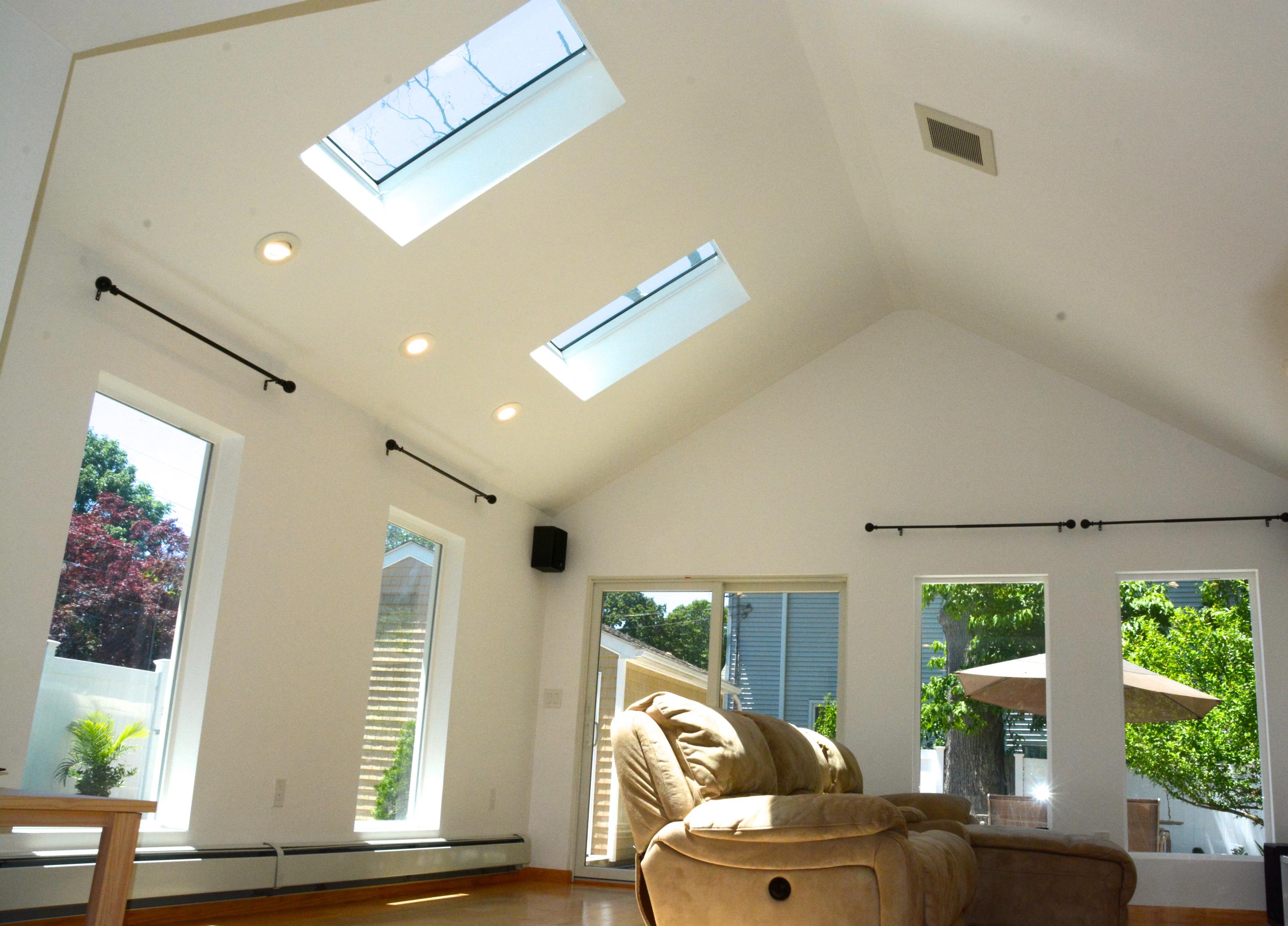165 Hollow Tree Ridge Road Darien, CT 06820 - Photo 8 of 37 a living room with furniture and a large window