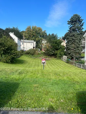 a fire hydrant in the middle of a field