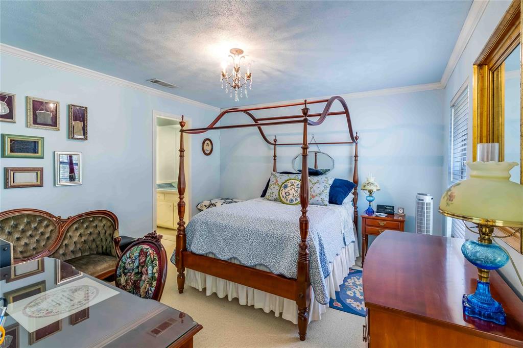 216 McMillen Road Lucas, TX 75002 - Photo 30 of 36 a bedroom with bed and wooden floor