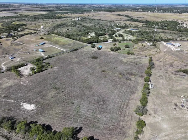 an aerial view of a beach with a yard