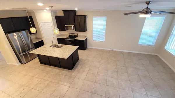 a living room with granite countertop furniture and a fireplace