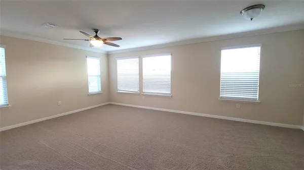 a view of an empty room with a window