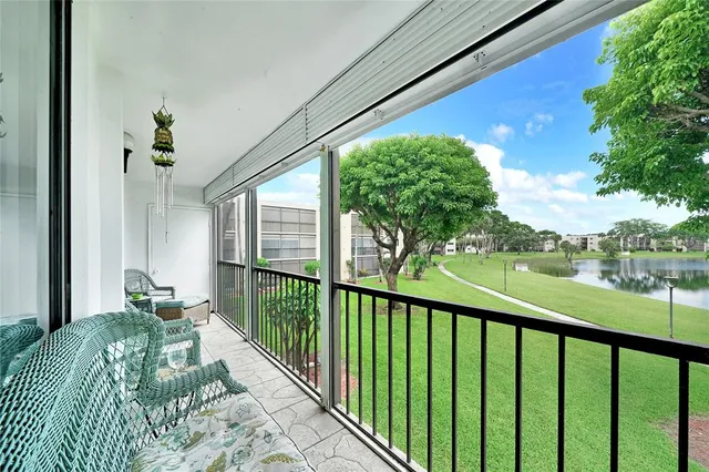 a view of balcony and yard
