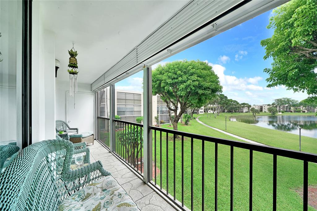 a view of balcony and yard