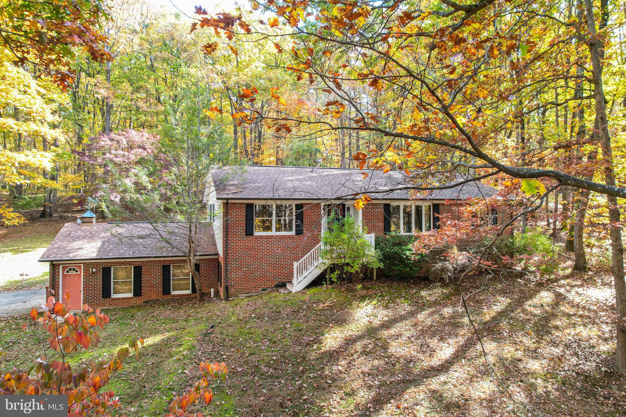 3870 Roop Road New Windsor, MD 21776 - Photo 15 of 59 front view of a house with a yard