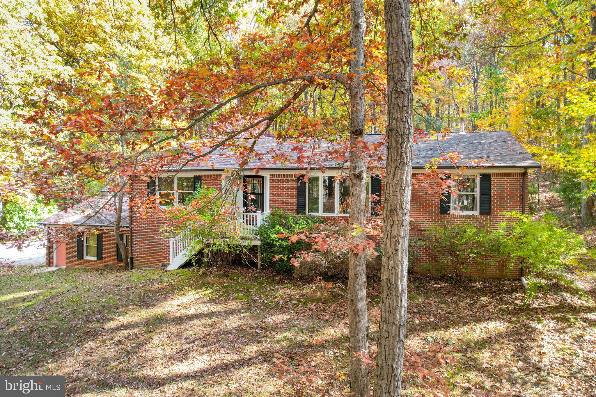 3870 Roop Road New Windsor, MD 21776 - Photo 16 of 59 a front view of a house with garden