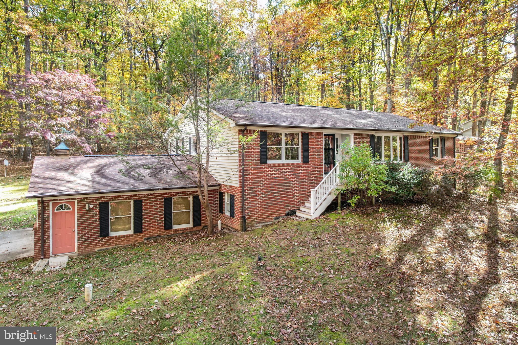 3870 Roop Road New Windsor, MD 21776 - Photo 17 of 59 front view of a house with a yard