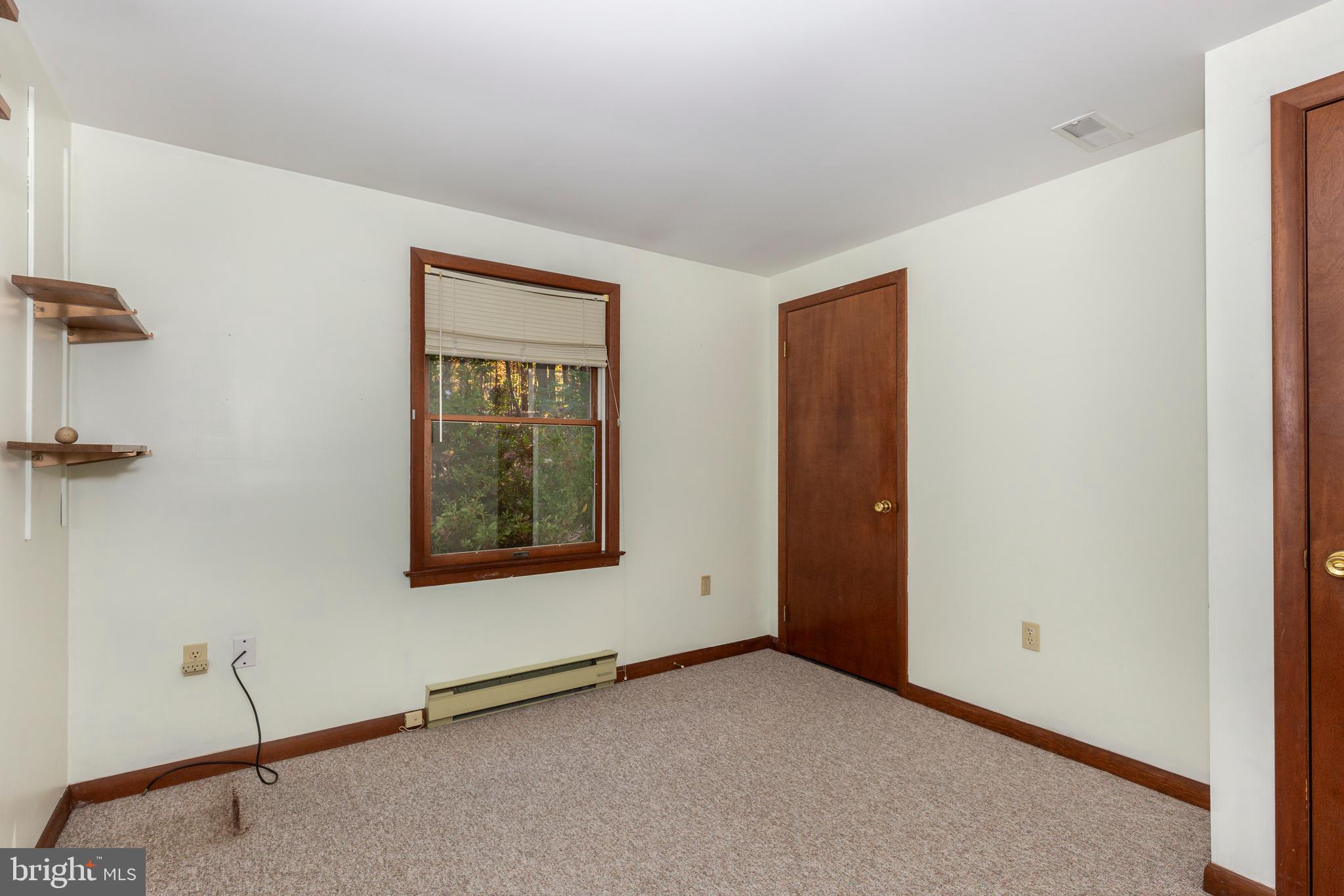 3870 Roop Road New Windsor, MD 21776 - Photo 30 of 59 a view of an empty room with a window