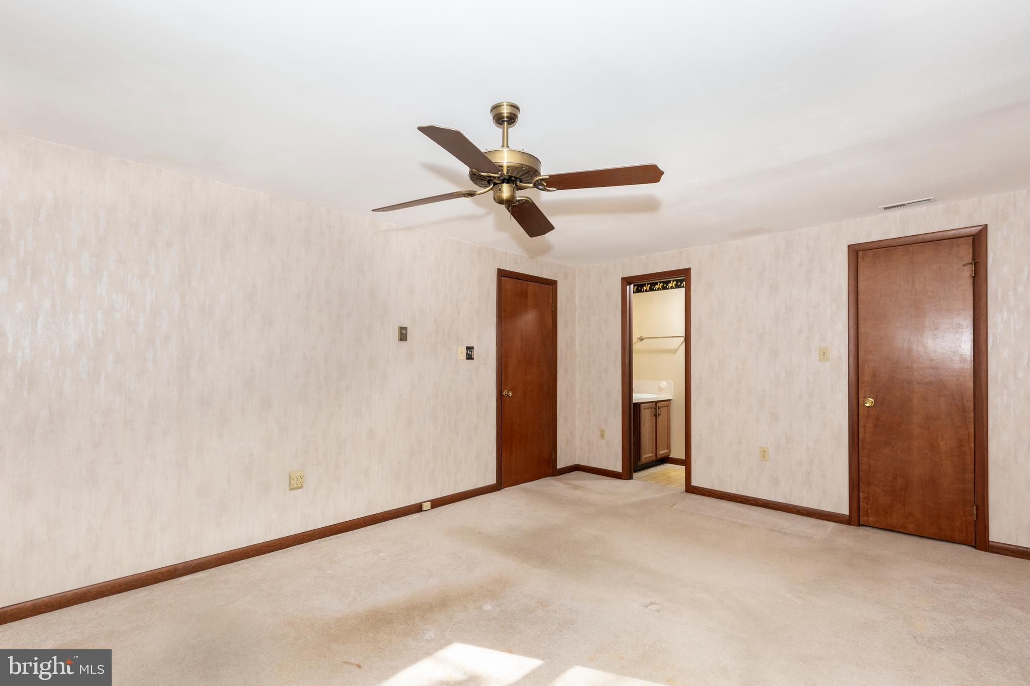 3870 Roop Road New Windsor, MD 21776 - Photo 34 of 59 a view of a livingroom with a ceiling fan