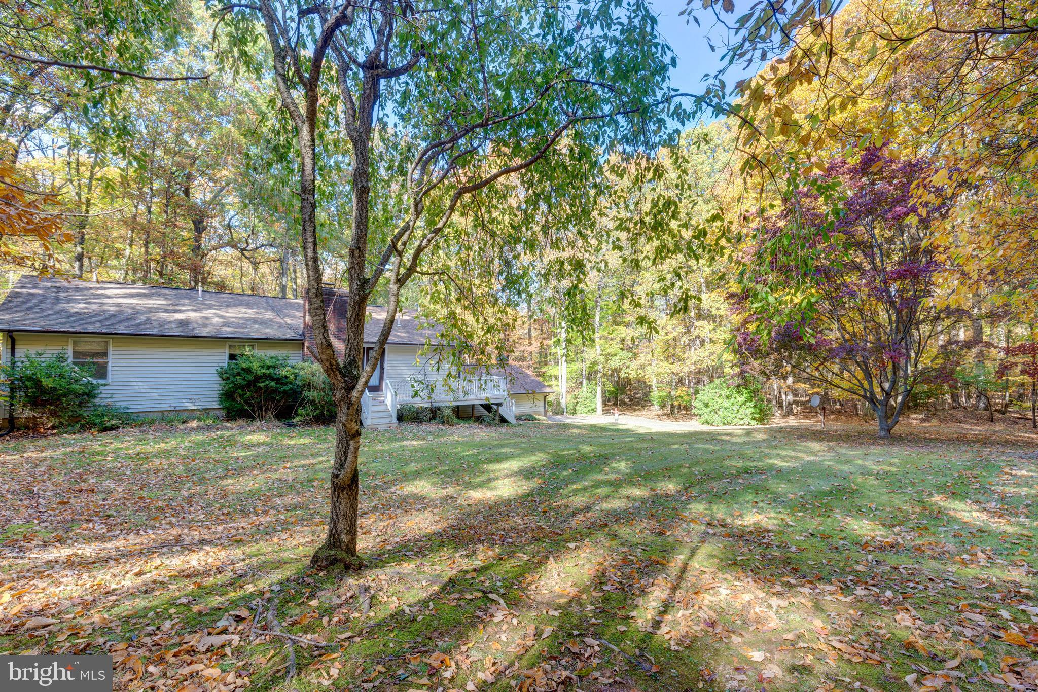 3870 Roop Road New Windsor, MD 21776 - Photo 50 of 59 a view of a house with a yard