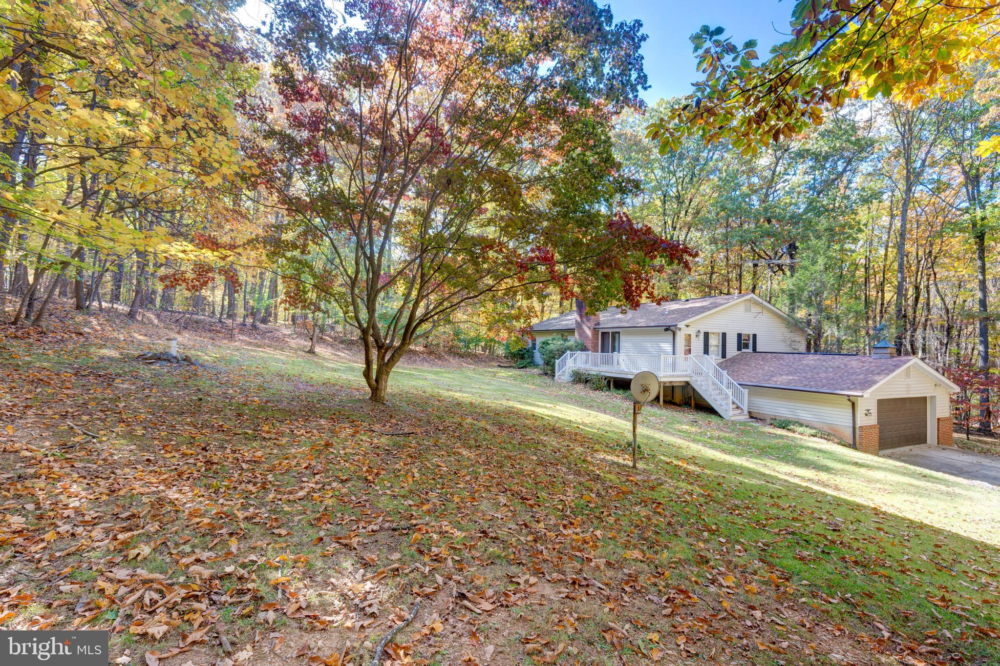 3870 Roop Road New Windsor, MD 21776 - Photo 53 of 59 a house with trees in front of it