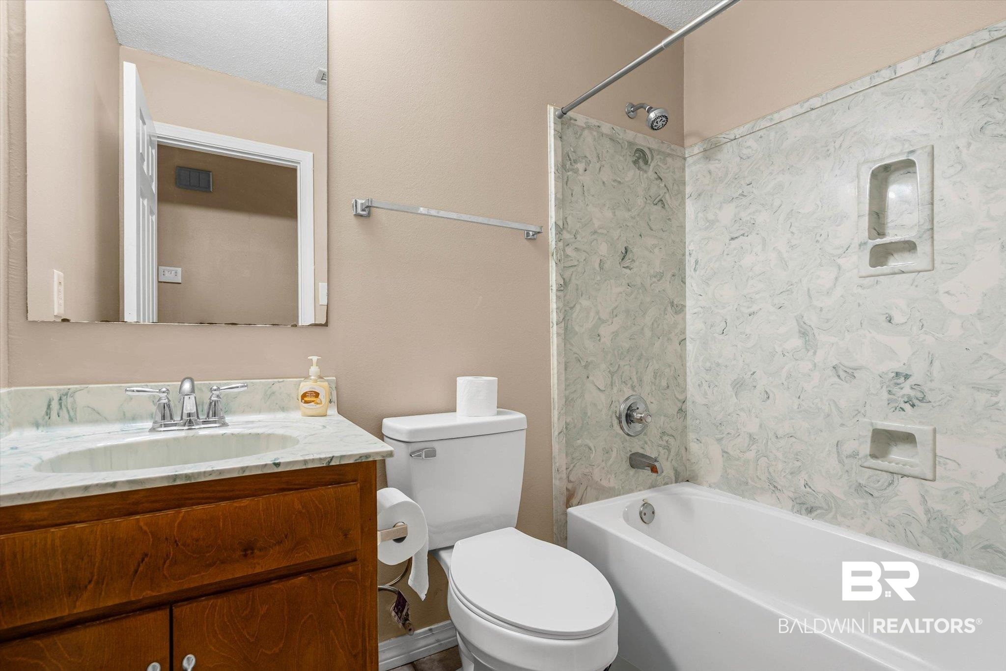 14165 River Oaks Road, Unit A & B Coden, AL 36523 - Photo 8 of 35 Bathroom with bathtub / shower combination, vanity, and a textured ceiling